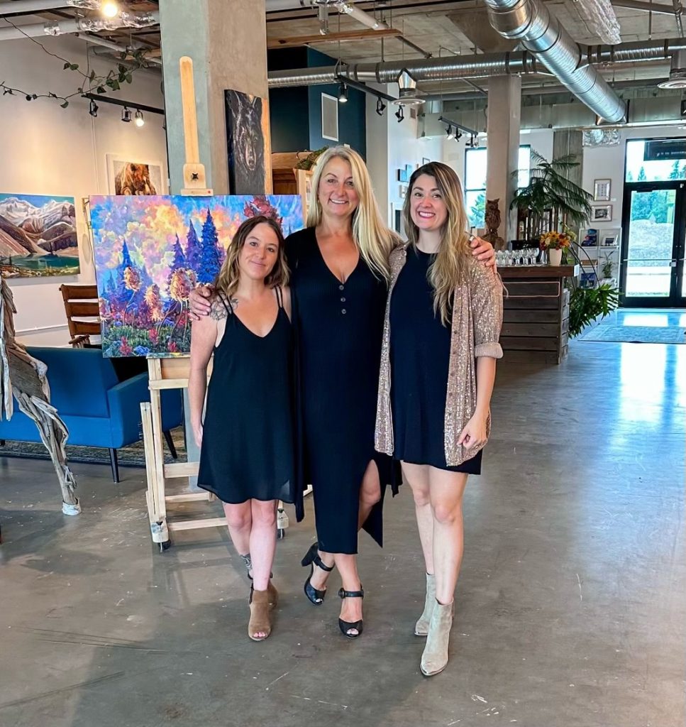 Revelstoke business Alpine Echo team standing in front of the gallery