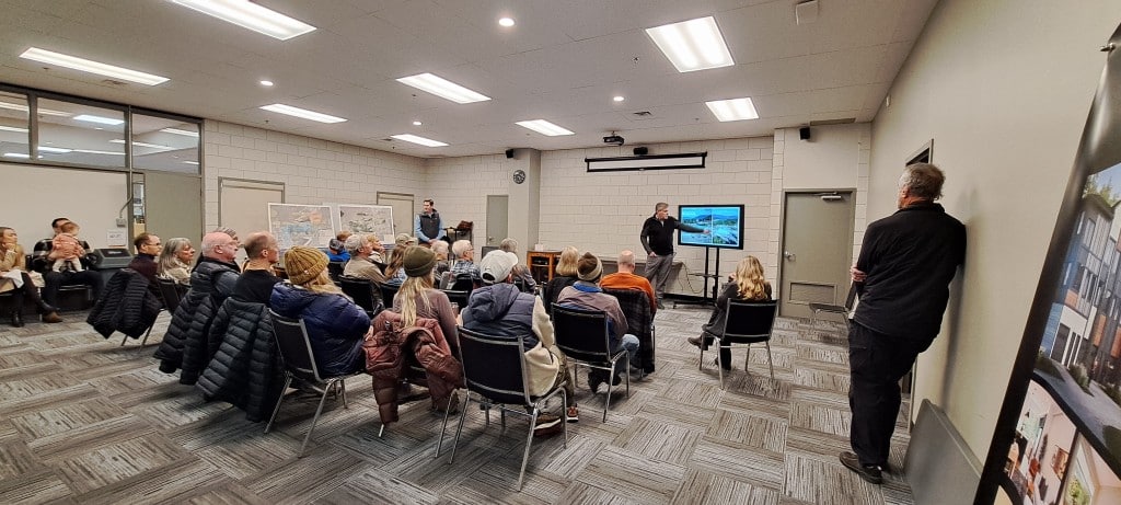 A crowd sits in a room listening to the Revelstoke Mountain Resort fall information session 2024