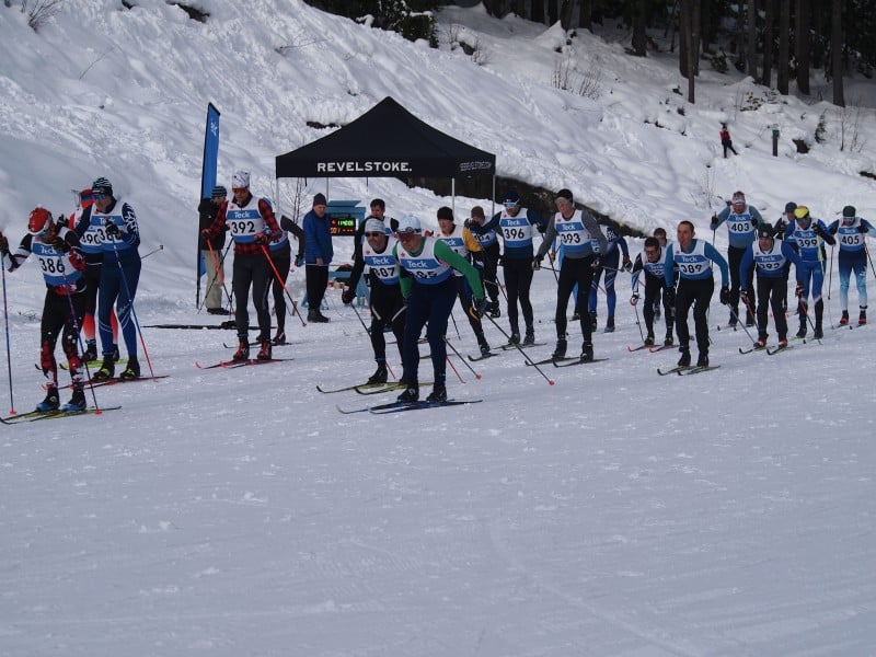 2025 Teck BC Cup One racers take off in one of the mass starts. There is roughly 20 cross country skiers all taking off at the same time.