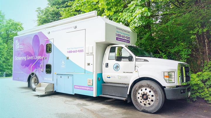 BC Cancer mobile mammography clinic, a large white utility box truck with BC Cancer decal information on the side of it.
