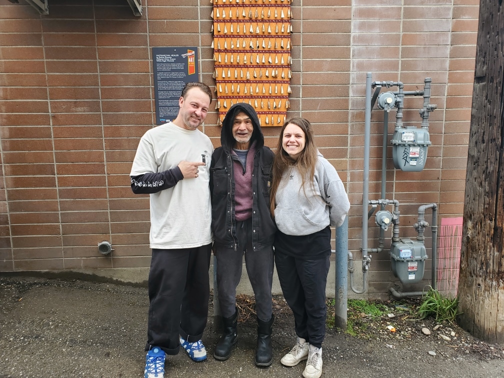 Patrick Edmonds with Dose staff John Pierce and Darcie Haswell.