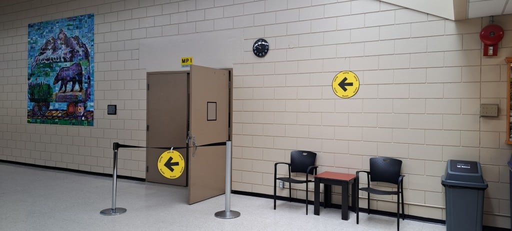 Signs for the Revelstoke polling location in the multipurpose room at Revelstoke Community Centre.