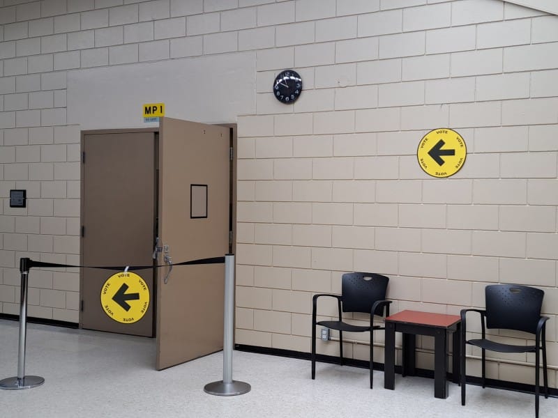 Signs for the Revelstoke polling location in the multipurpose room at Revelstoke Community Centre.