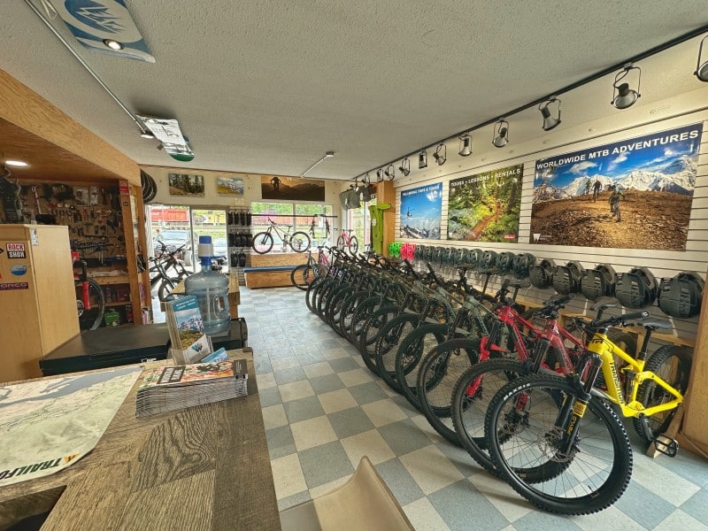 Wandering Wheels inside shop with a row of mountain bikes available for rent.