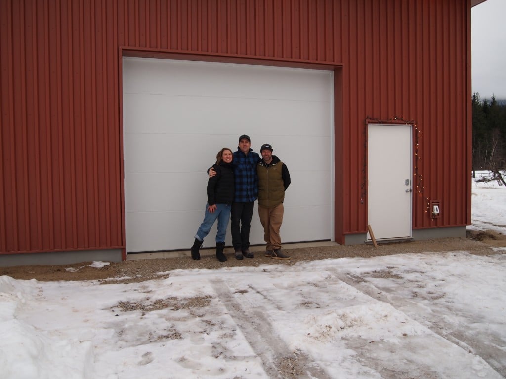 Jesse Johnston-Hill Jordan Cropper Chris Rubens standing in front of First Light Farms cold storage