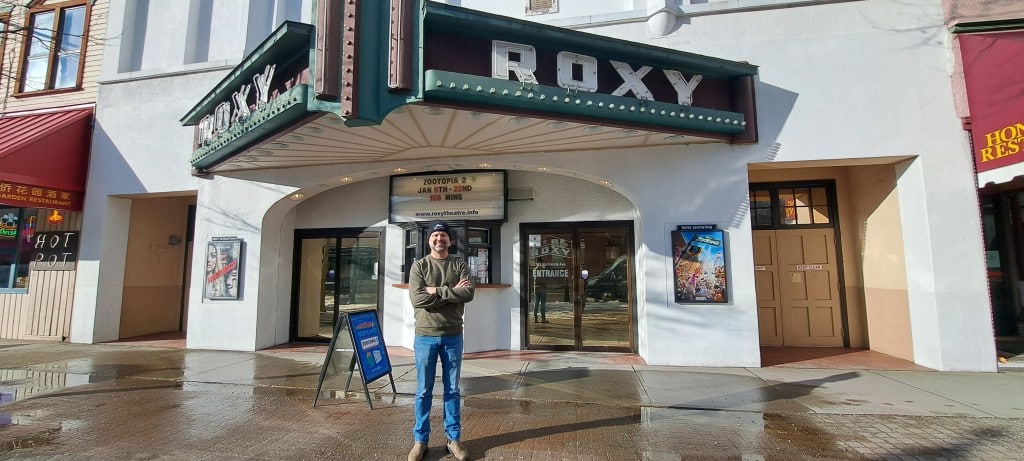 Revelstoke Roxy Theatre Greg Rose in front of theatre entrance