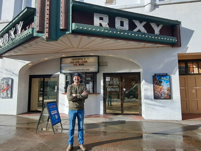 Revelstoke Roxy Theatre Greg Rose in front of theatre entrance