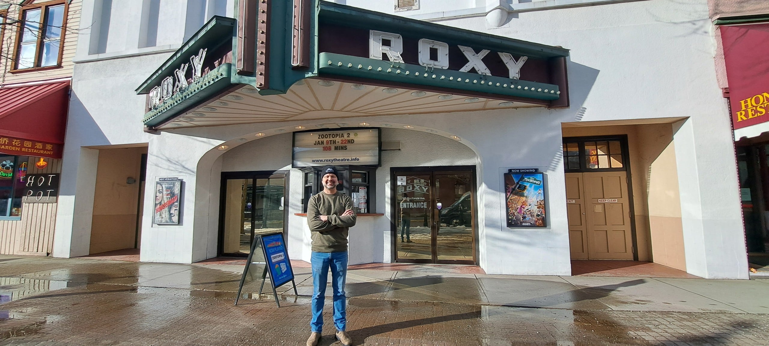 Revelstoke Roxy Theatre Greg Rose in front of theatre entrance