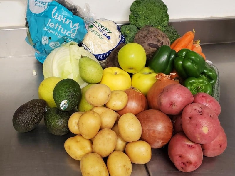 A collection of potatoes, green peppers, cauliflower, avocados and more produce, part of the Revelstoke Good Food Box offerings