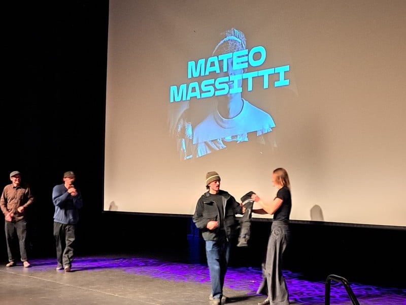 Mateo Massitti walking the stage for his YETI Natural Selection 2026 vest. Photo for Revelstoke Mountain Resort Stoke chair update story.