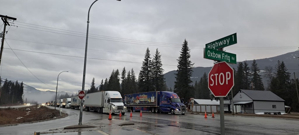 Semi and commercial trucks lined up on the Trans Canada Highway in Malakwa, image for the Revelstoke highway closure story