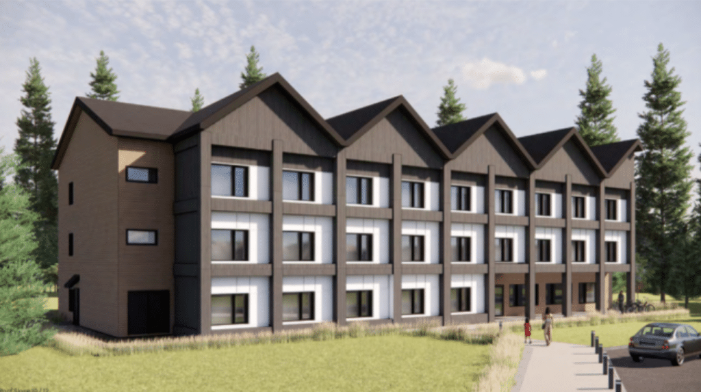 Computer generated image of Revelstoke Community Housing Society Oscar Lands proposed modular build, a three-story building with rows of windows