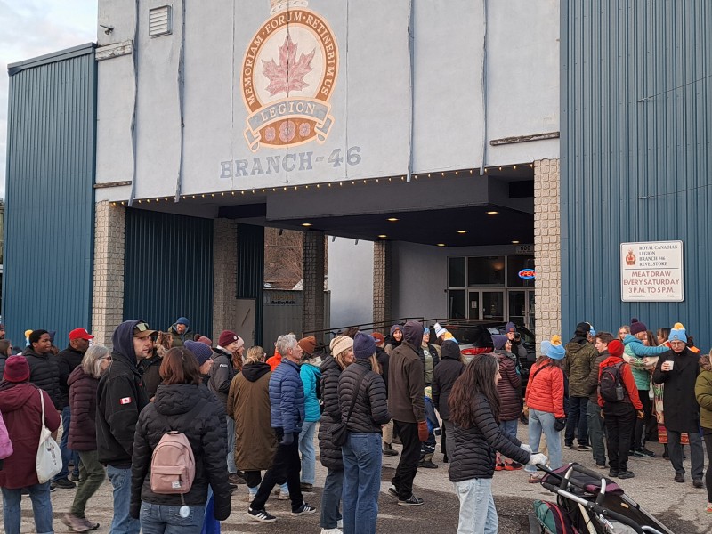 Coldest Night of the Year crowds gathered outside the Revelstoke Legion front door and parking.
