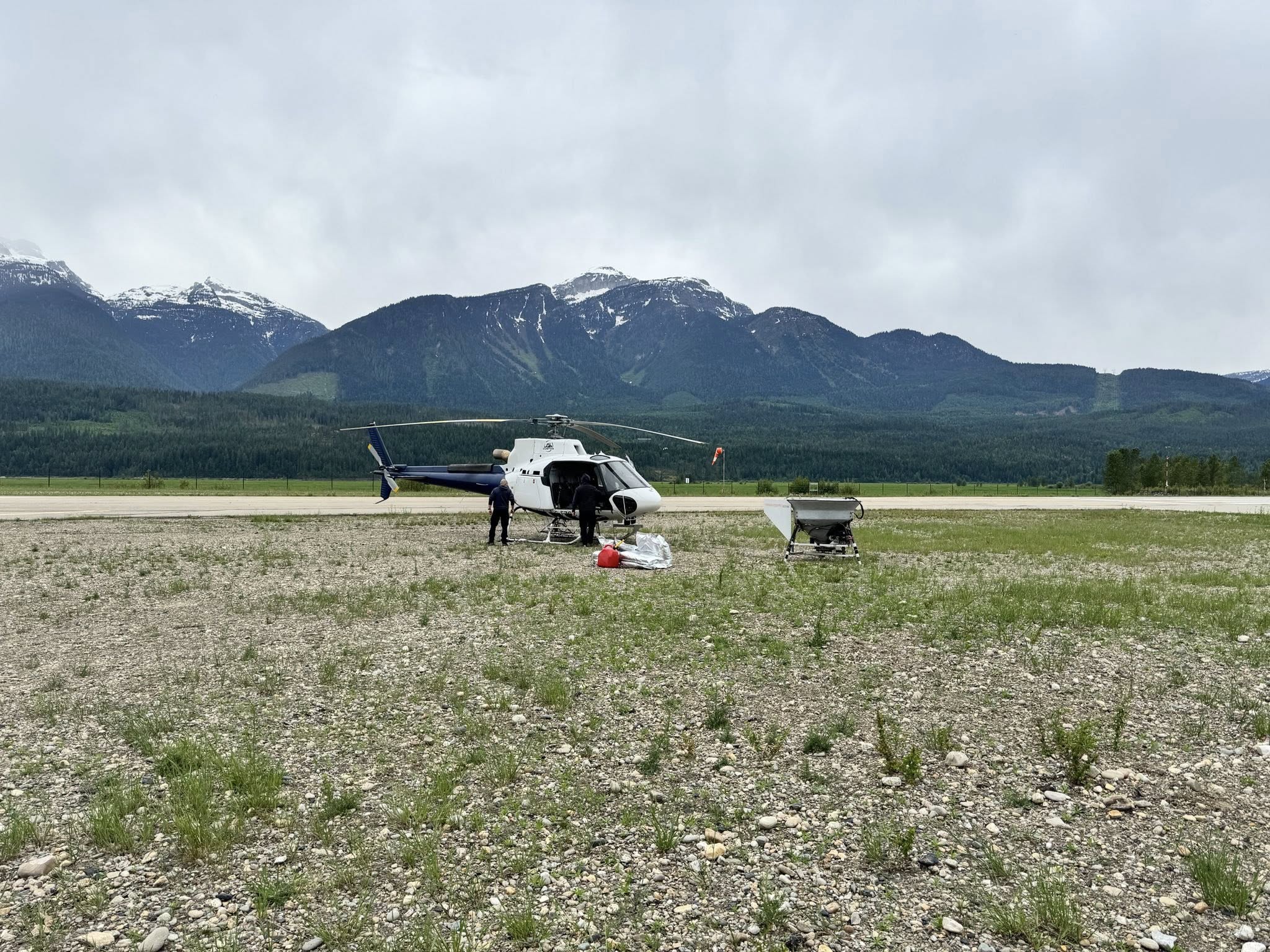 Helicopter with Revelstoke mosquito larvae treatment on the Columbia River flats.