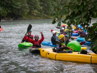Revy Paddle Fest 2025 competitors in various kayaks all on the river as they try and hit a floating yoga ball