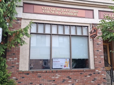 External shot of the Revelstoke council chamber where some of the Revelstoke council candidates will meet. It is a brick exterior with a large sign over the main window stating it's the chamber.